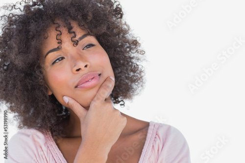 Photo: Pretty woman looking thoughtful Pretty woman looking thoughtful