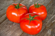 Photo: Tomatoes on the old wooden floor Tomatoes on the old wooden floor