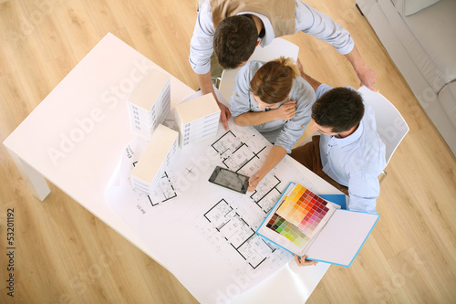 Photo: Upper view of architects working in office Upper view of architects working in office