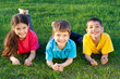 Photo: Three smiling kids on the meadow Three smiling kids on the meadow