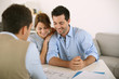 Photo: Young couple meeting architect for future house Young couple meeting architect for future house
