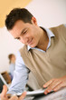 Handsome guy working with tablet in office