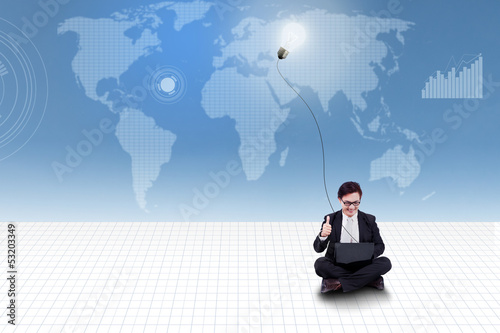 Photo: Businessman give thumb up on world map background Businessman give thumb up on world map background