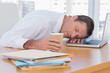 Businessman sleeping on a laptop