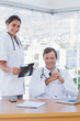Cheerful group of doctors working on a x ray