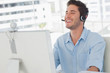 Photo: Happy designer laughing during an online communication Happy designer laughing during an online communication