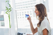 Cheerful designer purchasing online
