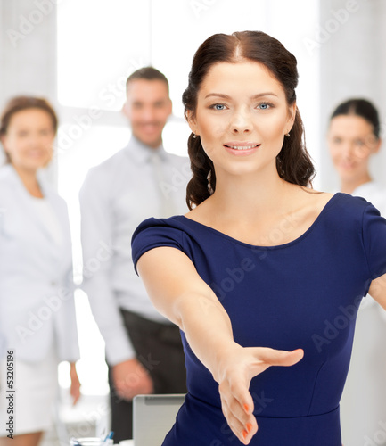 Photo: woman with an open hand ready for handshake woman with an open hand ready for handshake