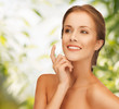 Photo: beautiful woman with moisturizing creme drop beautiful woman with moisturizing creme drop