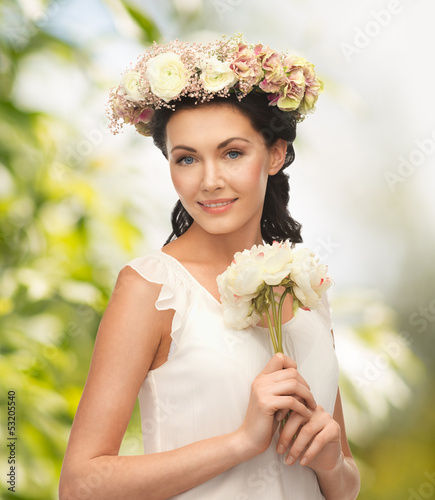 Photo: woman wearing wreath of flowers woman wearing wreath of flowers