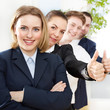 Successful business people are in line, show thumbs up
