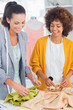 Photo: Cheerful fashion designers touching textile Cheerful fashion designers touching textile