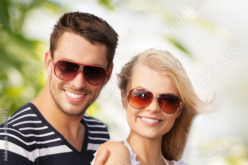 Photo: happy young couple in the woods happy young couple in the woods