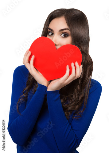 Photo: Young beautiful women peeking from the heart shape Young beautiful women peeking from the heart shape
