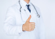 male doctor hand showing thumbs up