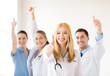 group of doctors showing thumbs up
