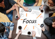Photo: Focus written on a poster with drawings of charts Focus written on a poster with drawings of charts