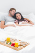 Photo: Beautiful couple sleeping in their bed Beautiful couple sleeping in their bed