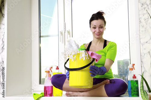 Photo: Women cleaning a window Women cleaning a window