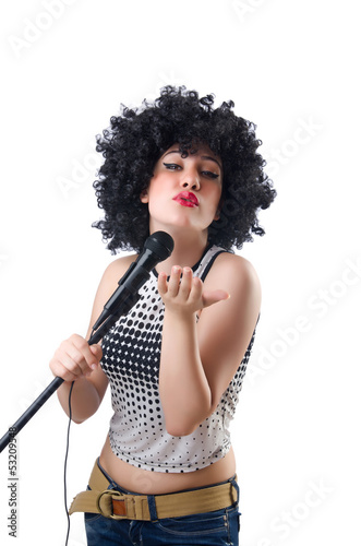 Photo: Pop star with mic on white Pop star with mic on white