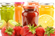 Foto: Composition with jars of fruity jams on white. Preserved fruits Composition with jars of fruity jams on white. Preserved fruits