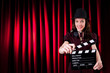 Woman gangster with movie clapper