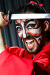 Man with sword and face mask