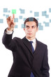 Foto: Young businessman pressing virtual buttons Young businessman pressing virtual buttons