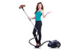 Young woman with vacuum cleaner on white