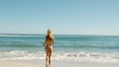 Young woman running on the beach