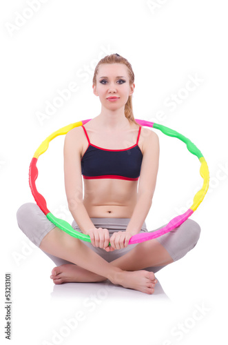Photo: Woman doing exercises with hula hoop Woman doing exercises with hula hoop