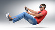 Photo: Funny bearded man car driver in goggles with a wheel Funny bearded man car driver in goggles with a wheel