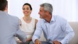 Video: Couple signing a contract given by a salesman Couple signing a contract given by a salesman