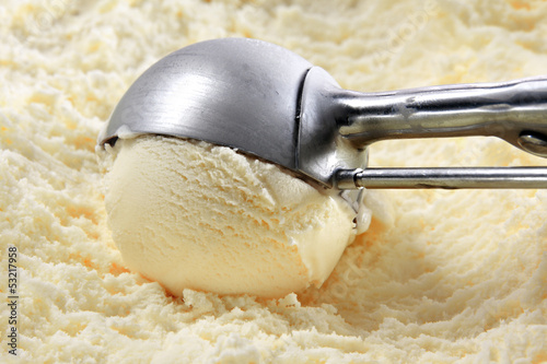Photo: Vanilla ice cream scooped out of container Vanilla ice cream scooped out of container