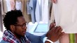 Fashion designer working on a dress on a model
