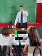 Teacher Pointing At Students In Classroom