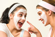 Photo: Two girls with cosmetic mask laughing Two girls with cosmetic mask laughing