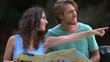 Video: Couple reading a map and smiling Couple reading a map and smiling