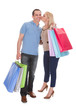 Photo: Portrait Of Young Couple Holding Shopping Bag Portrait Of Young Couple Holding Shopping Bag