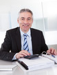 Photo: Mature Businessman At Work Mature Businessman At Work