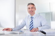 Mature Businessman Working At Desk