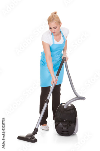 Photo: Portrait Of Woman Holding Vacuum Cleaner Portrait Of Woman Holding Vacuum Cleaner
