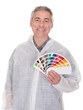Mature Man With Protective Workwear Holding Color Swatch