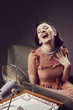 Photo: Woman cooling herself with fan Woman cooling herself with fan