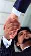 The conclusion of the transaction. Handshake.