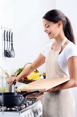 Photo: Home chef cooking in the kitchen Home chef cooking in the kitchen