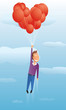Guy floating with valentine balloons