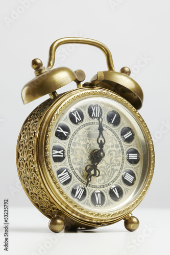 Photo: Old antique brass alarm clock Old antique brass alarm clock