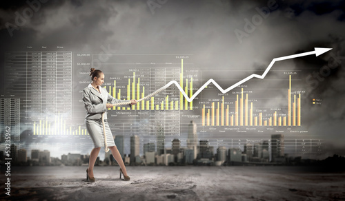 Photo: Businesswoman pulling graphic Businesswoman pulling graphic