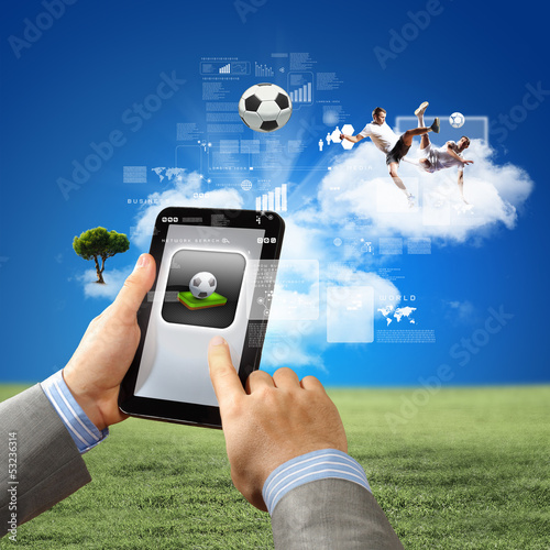 Photo: Close-up of man hands holding tablet pc Close-up of man hands holding tablet pc